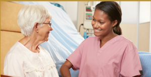 nurse smiling to an old woman